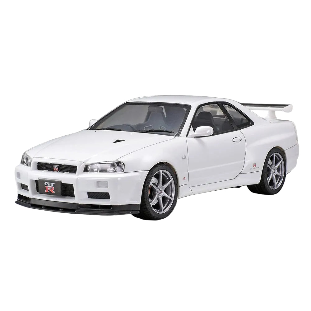 White sports car with silver wheels on a gray background