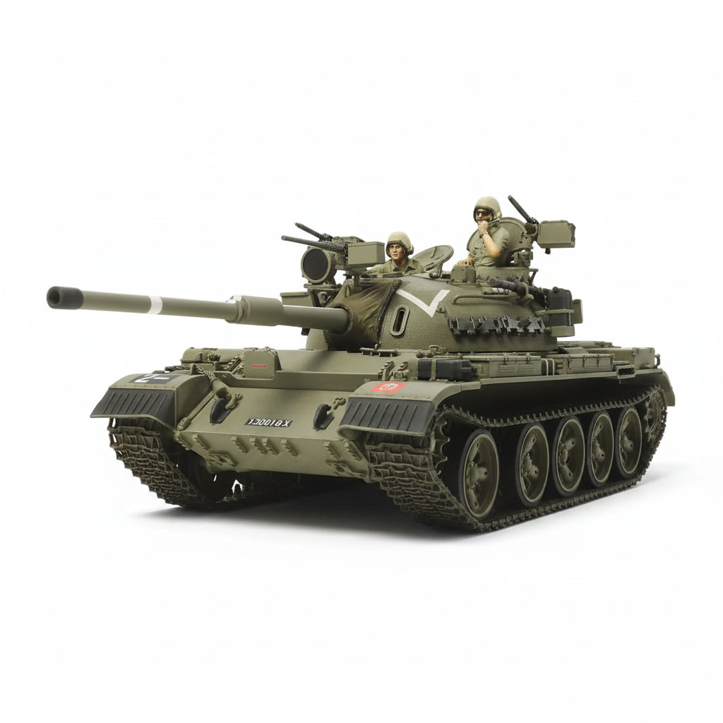 A Tamiya 1/35 Tiran 5 Israeli Tank Plastic Model Kit destroyer in olive green camouflage, featuring two small toy soldiers on top, photographed on a seamless white background.
