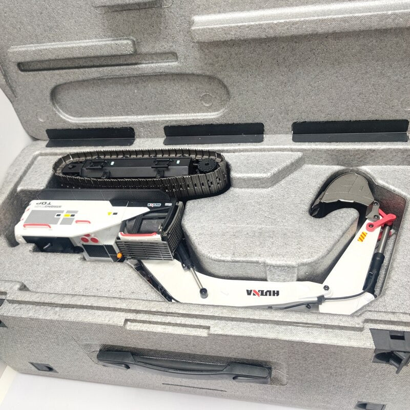 Huina 1594 RC EXCAVATOR in a gray carry foam case on a white background
