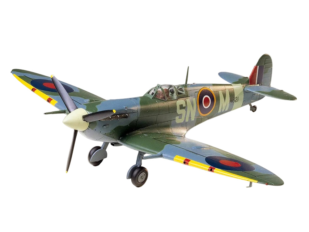 Model of a vintage military airplane with camouflage paint scheme on a white background