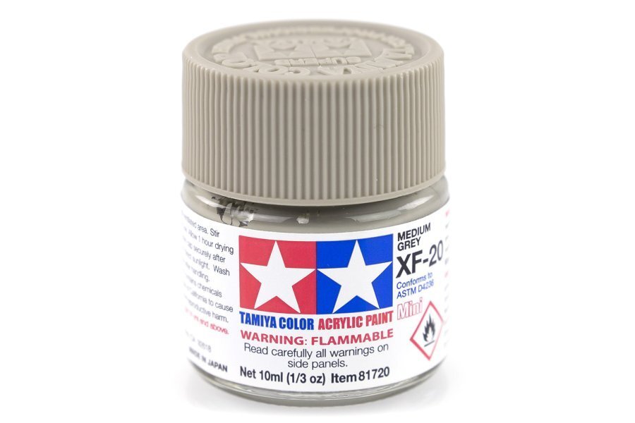 A bottle of Tamiya Acrylic Mini XF-20 Medium Grey paint.