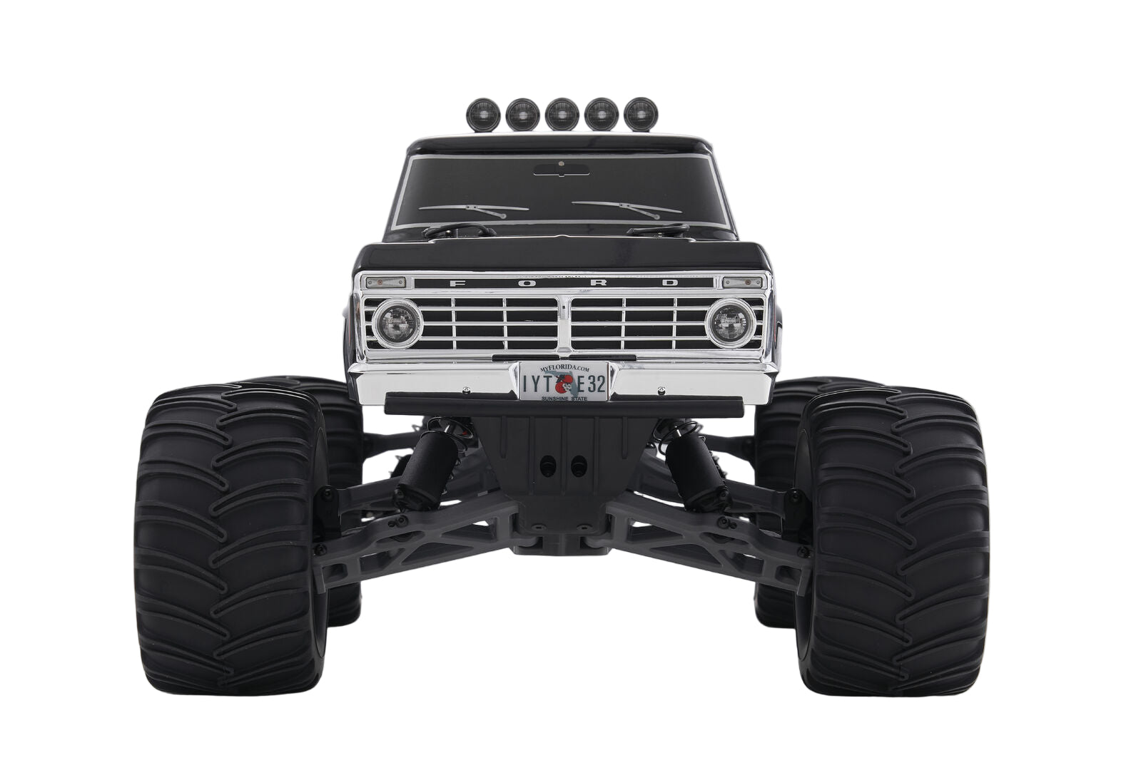 Front veiw RC Monster truck with large black tires on a white background