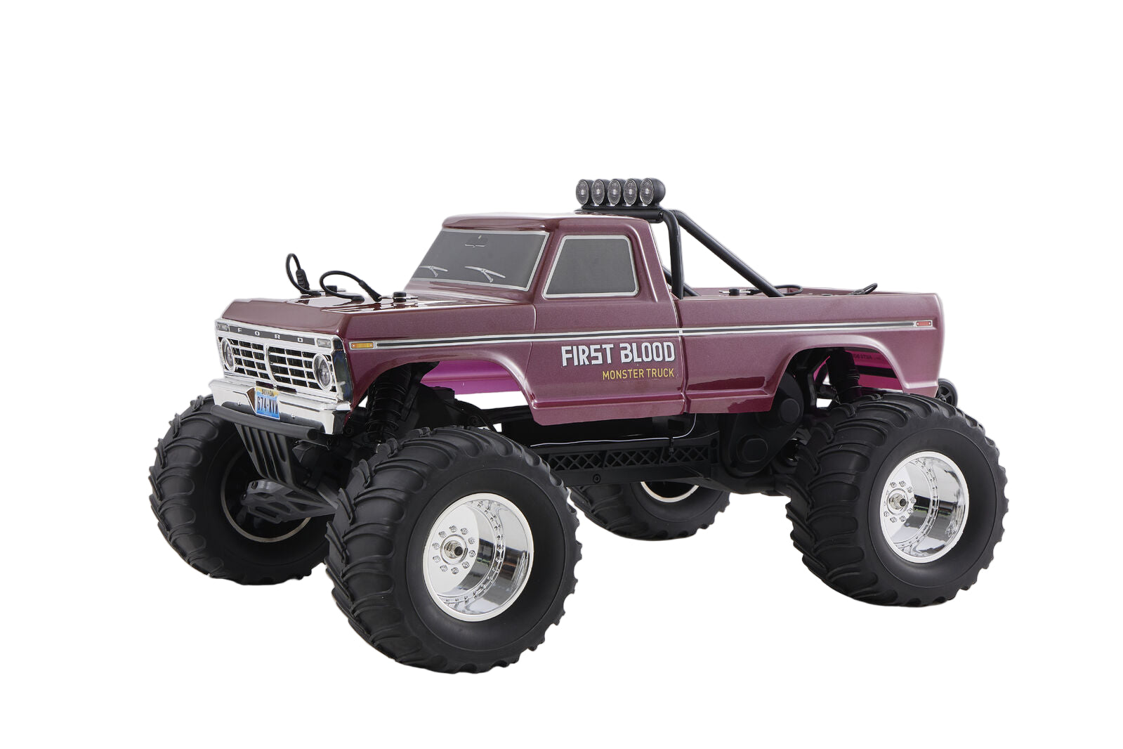Model truck with large wheels and 'First Blood' branding on a gray background