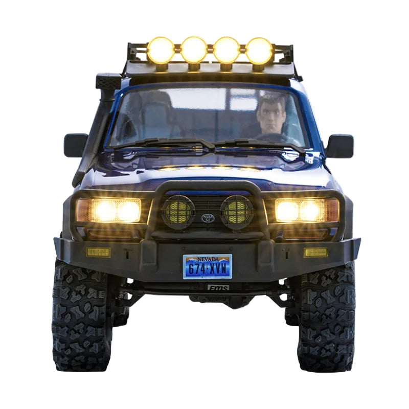 Front view of a rugged vehicle with large headlights and a license plate on a white background