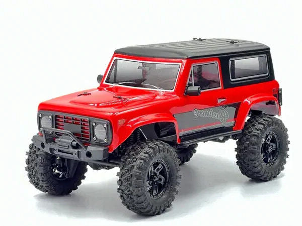 Red off-road model vehicle with black roof on a white background