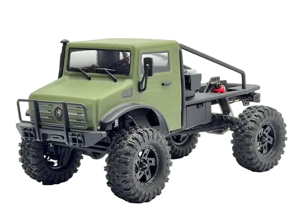 Green model truck with large wheels on a white background