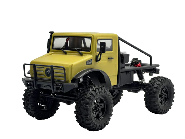 Model of a yellow off-road vehicle with large black tires on a white background