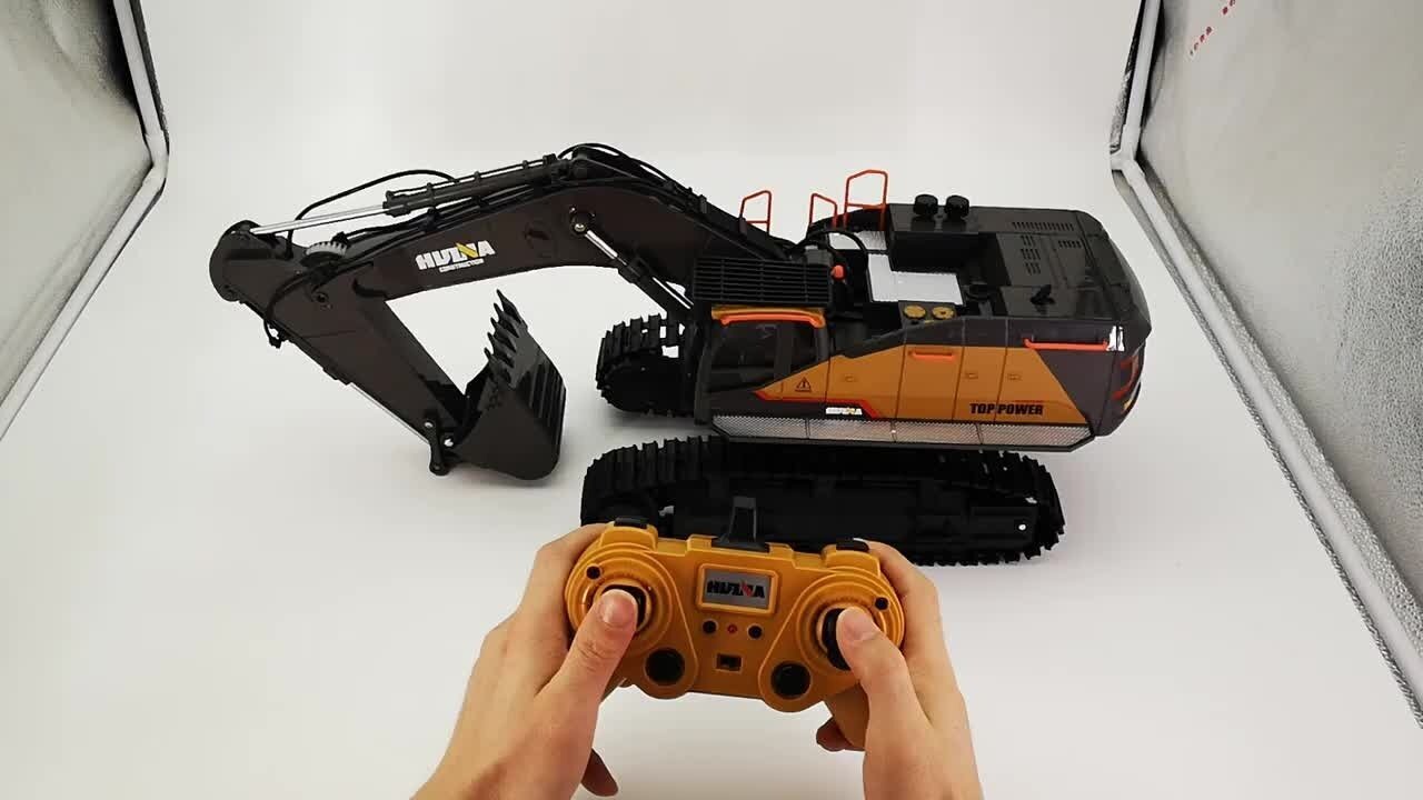 Toy excavator with remote control on a white background