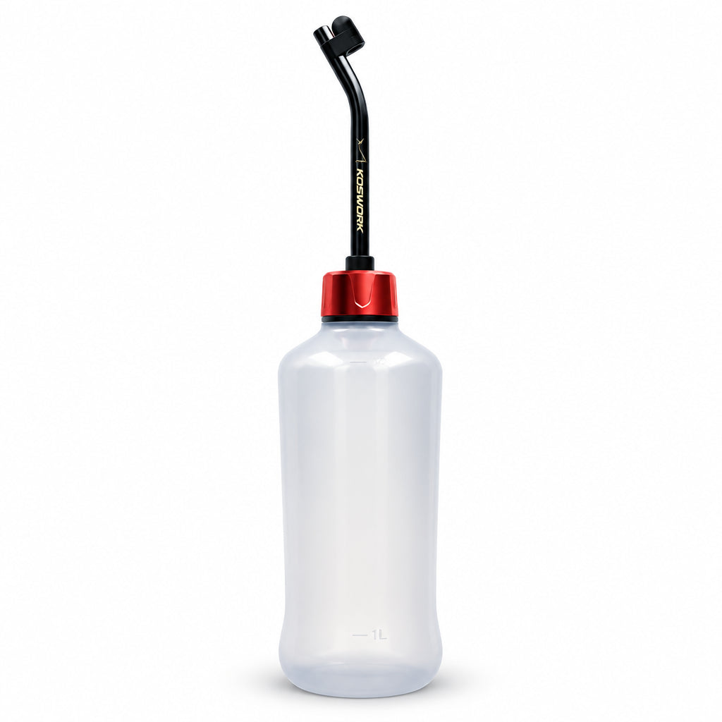 A clear plastic fuel bottle with a red collar and a black angled nozzle, shown on a plain white background.