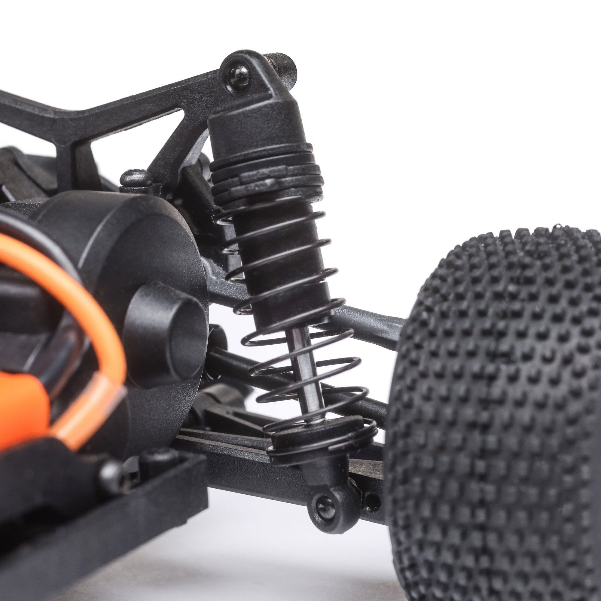 Close-up of Losi Micro-T oil-filled shocks and suspension system