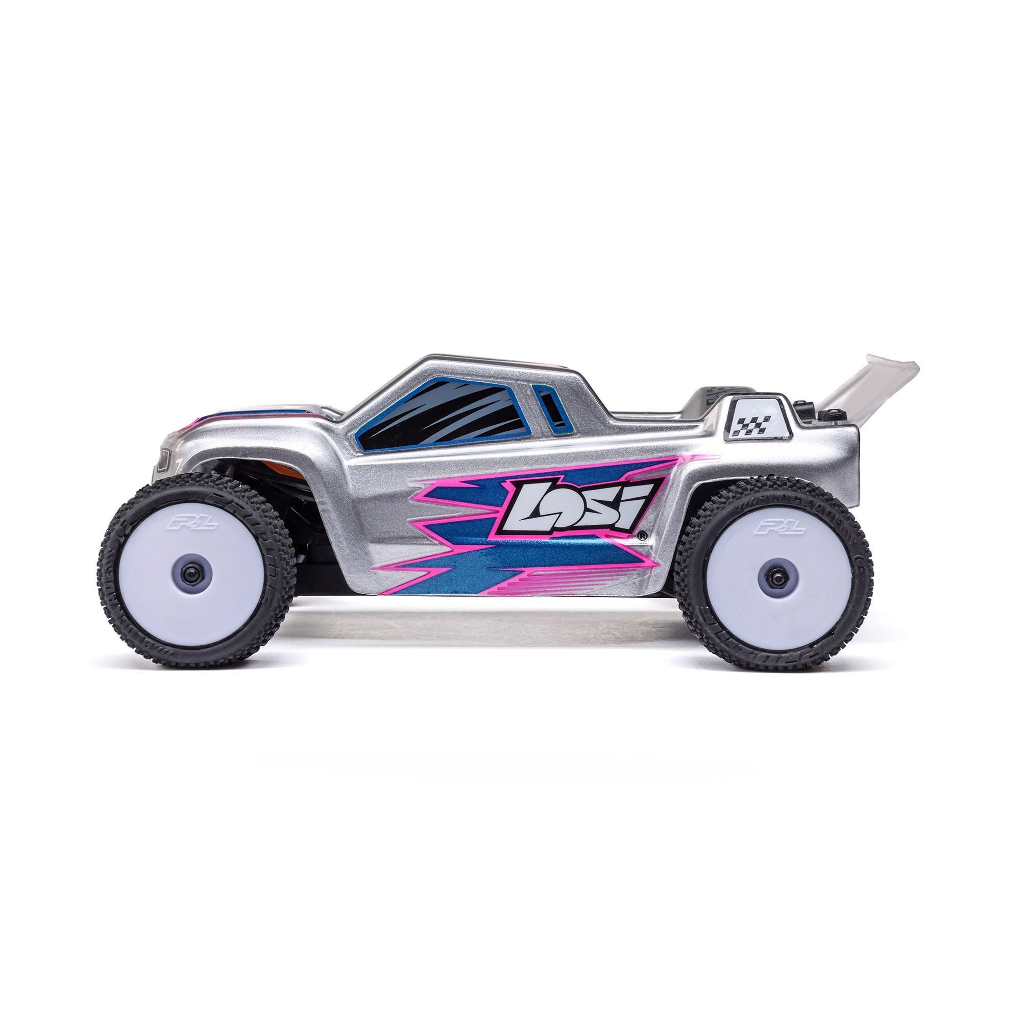 Side view of Losi Micro-T RC Stadium Truck showing aluminum chassis and Pro-Line Racing wheel