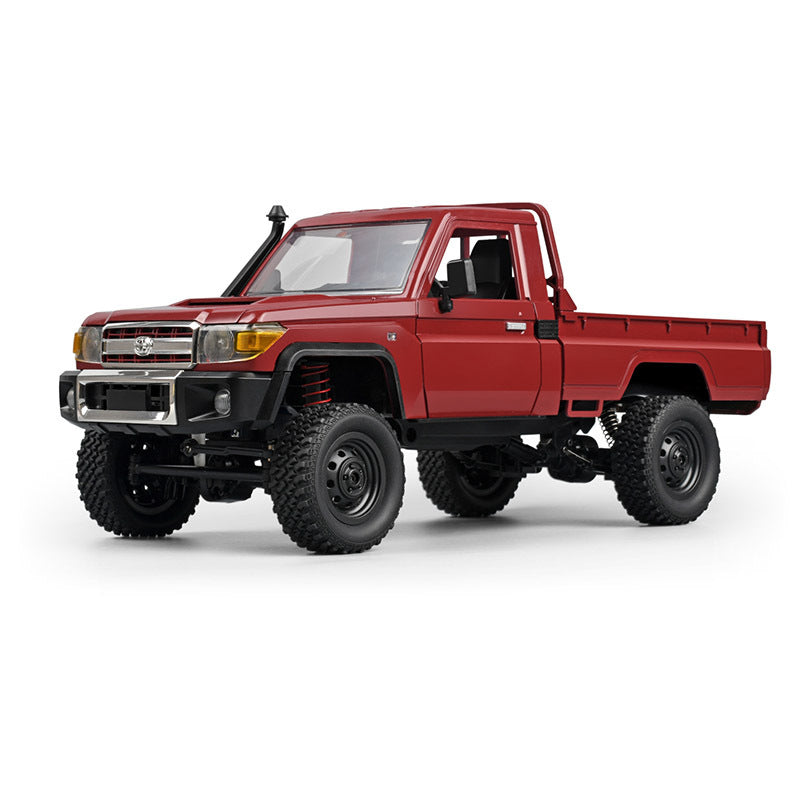 A Red MN Model 1/12 Toyota LC79 RC Crawler on a white background