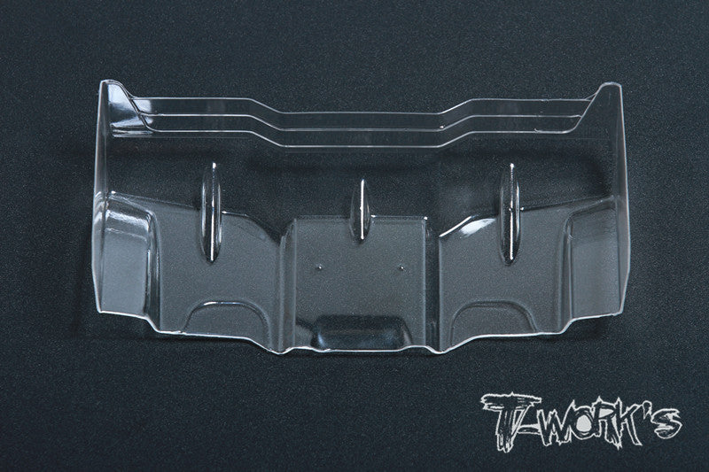close up of a T-Works TE-120L clear Lexan Rear Wing 1/10 Scale with T works Branding logo on a black background.