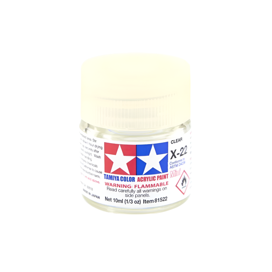 A bottle of Tamiya Acrylic Mini X-22 (87064) Clear paint with a white cap and label.