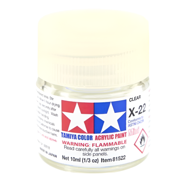 A bottle of Tamiya Acrylic Mini X-22 (87064) Clear paint with a white cap and label.