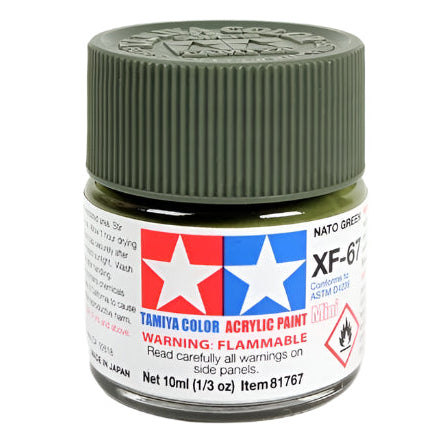 Jar of Tamiya color acrylic paint with green lid on a white background