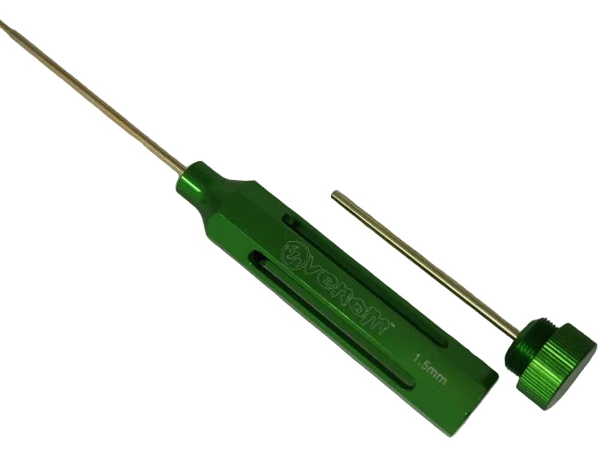 A green anodized aluminum precision tool with a long brass rod and a separate matching cap, shown on a neutral light gray background. The tool features the brand name 'Yanoff' and '1.