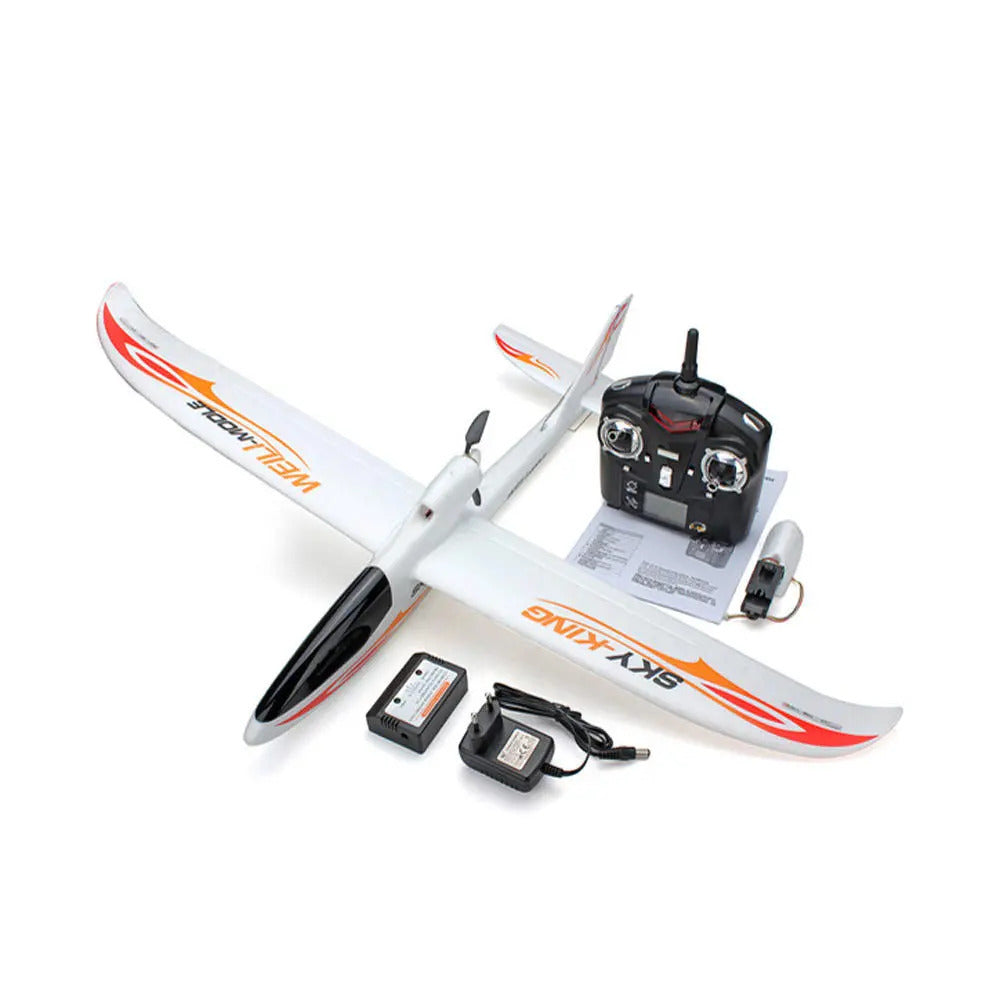 WL Toys Sky King RC Glider airplane with remote control and battery on a white background