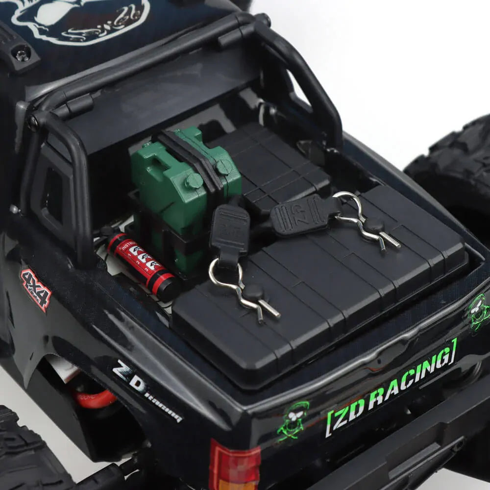 ZD Racing MT-16 1/16 4WD Brushless Monster Truck rear view with Jerry can and fire extinguisher and accessory's in the cars tray