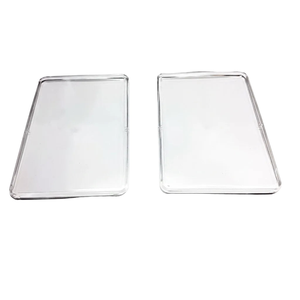 Two clear rectangular glass or acrylic protective covers with rounded corners, displayed side-by-side on a plain white background.
