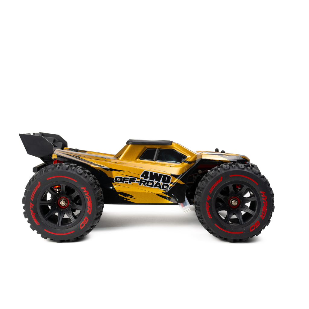 A Gold MJX 1/14 Hyper Go 4WD Off-road Brushless RC Truggy 14210 side on view with hyper go in red written on the sidewall of the off-road tires on white background.