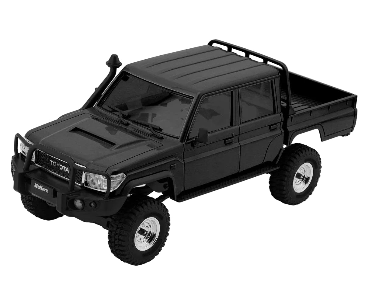 Black toy truck model on a white background