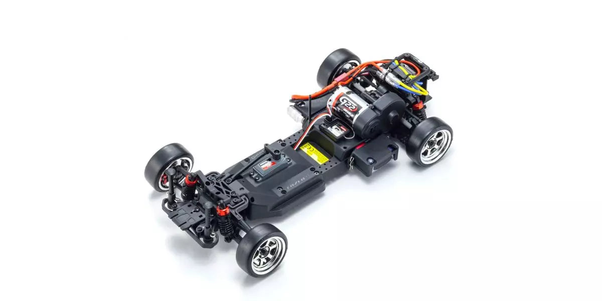 Black RC car chassis on a white background