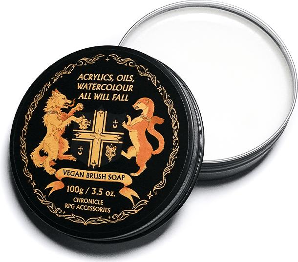 Chronicle Vegan Brush Soap (100g) black container with decorative design and text on a white background