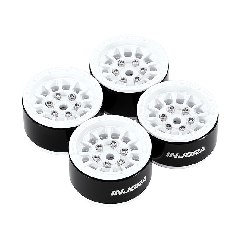 Four INJORA wheels on a white background