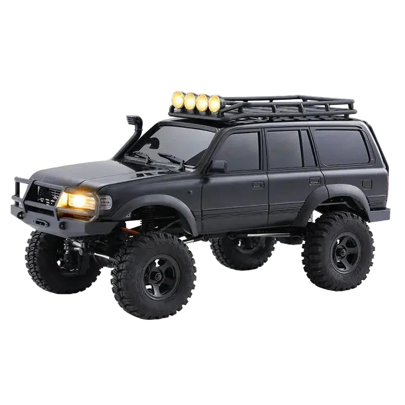 Model of a black off-road vehicle with large wheels on a white background