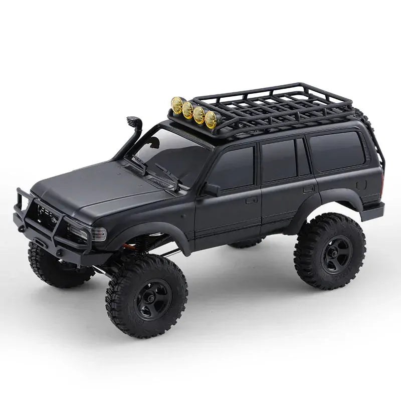 Black off-road model vehicle with roof rack and lights on a white background