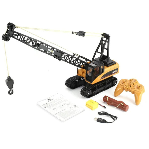 RC Toy crane with remote control, battery, and instructions on a white background