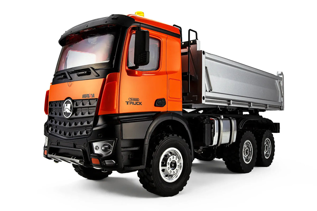 Close up of cab on the Huina HN1598 1/14 scale electric 4WD RTR dump truck in orange on a white background.