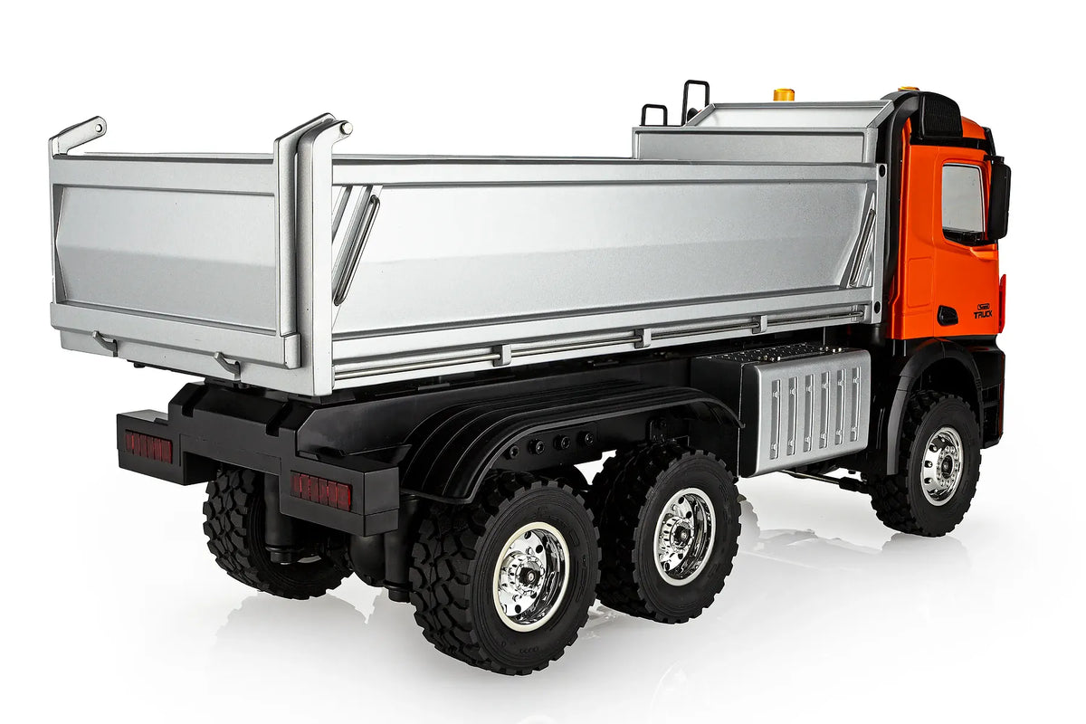 Rear view of Huina HN1598 1/14 scale electric 4WD RTR dump truck in orange on a white background.