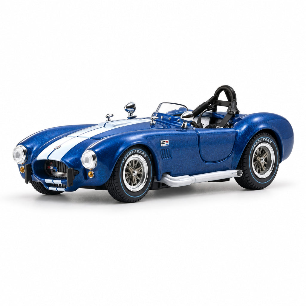 A blue model sports car with white racing stripes, black roll bars, and silver wheels, photographed on a clean white studio background.