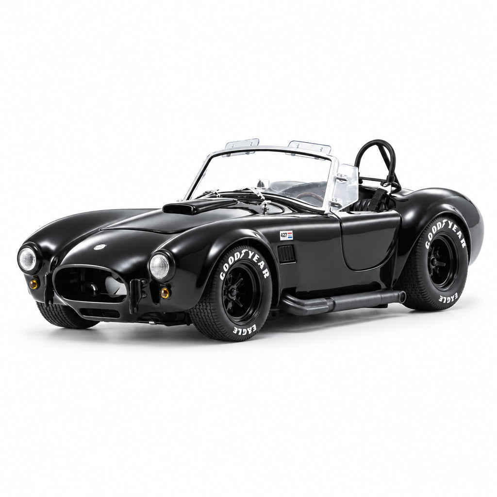 Black model car on a white background