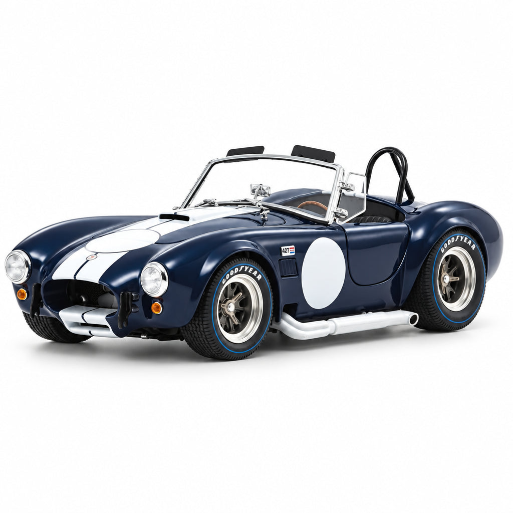 Model of a classic blue and white sports car on a white background
