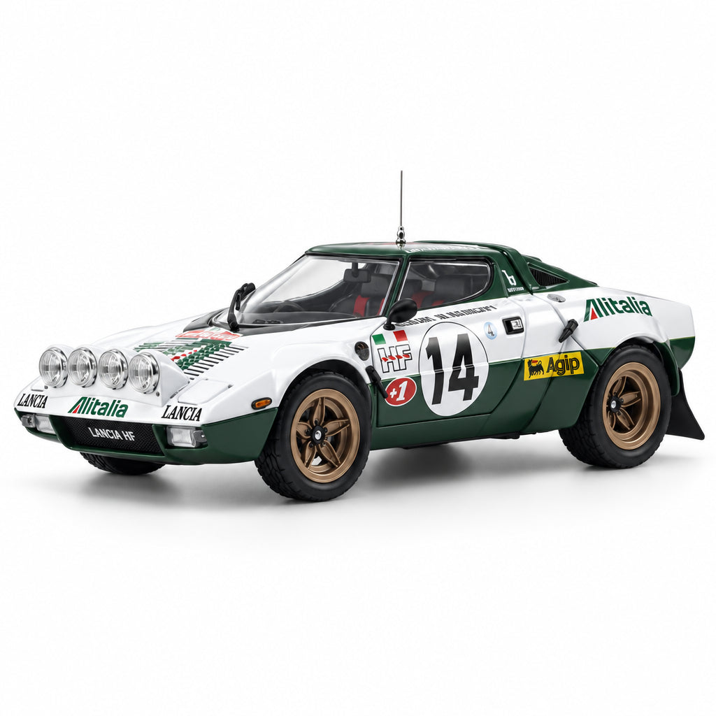 A scale model of a white and dark green rally car with gold wheels and various racing decals, including number 14, photographed on a seamless white studio background.