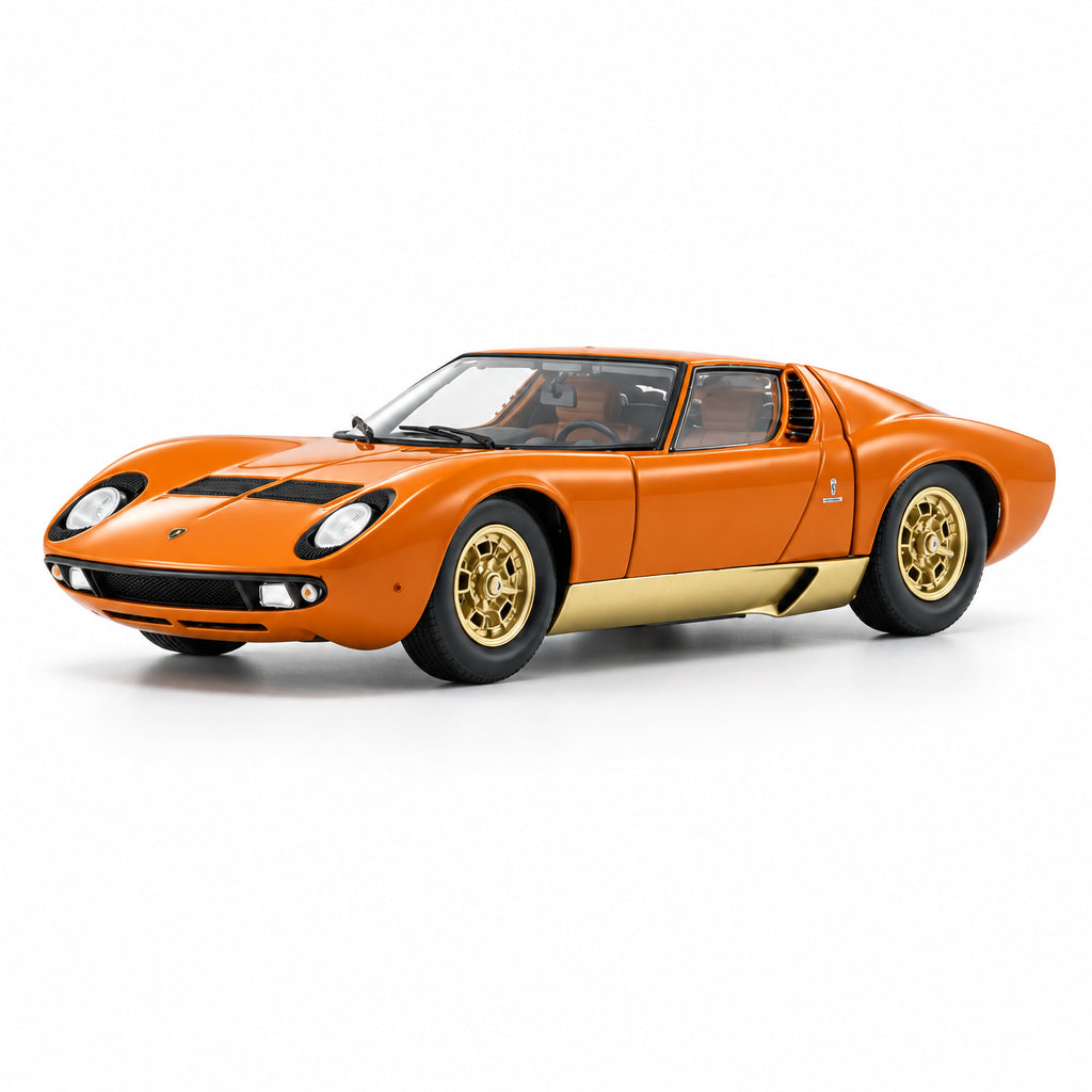 An orange model sports car with gold wheels and a beige lower side panel, photographed on a clean white background.
