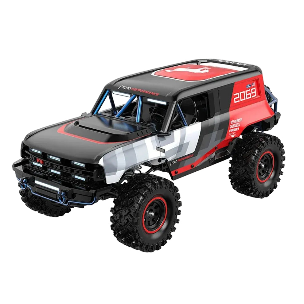 Model of a black and red off-road vehicle on a white background