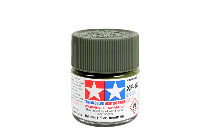 Jar of Tamiya color acrylic paint with green lid on a white background