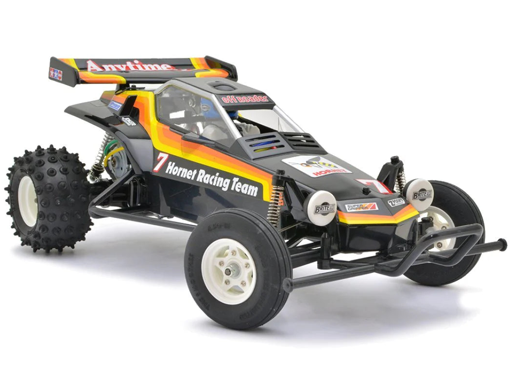 A black Tamiya The Hornet 1/10 2WD 2004 Edition RC Buggy Assembly Kit with ESC, featuring a bathtub frame, large off-road tires, and a multicolored stripe design.