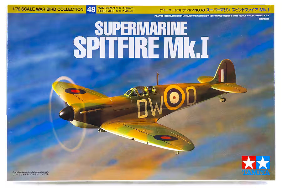 Front of a Tamiya 1:72 scale model kit box for the Supermarine Spitfire Mk.I, showing a painted military aircraft flying against a blue sky with clouds, plus product text and the Tamiya logo.