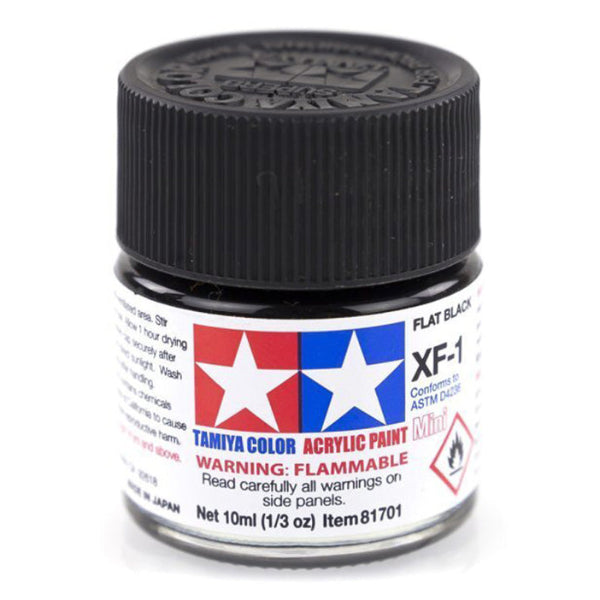 A small glass bottle of Tamiya Acrylic Mini XF-1 Flat Black paint with a black cap and label.