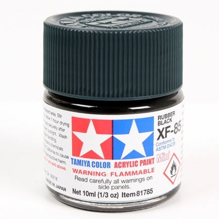 Tamiya model paint jar with black lid on a white background