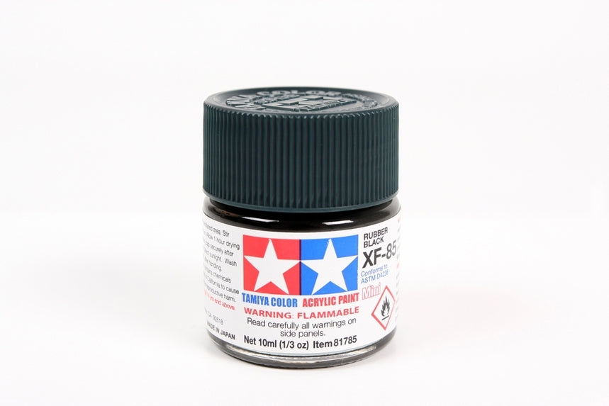 Tamiya model paint jar with black lid on a white background