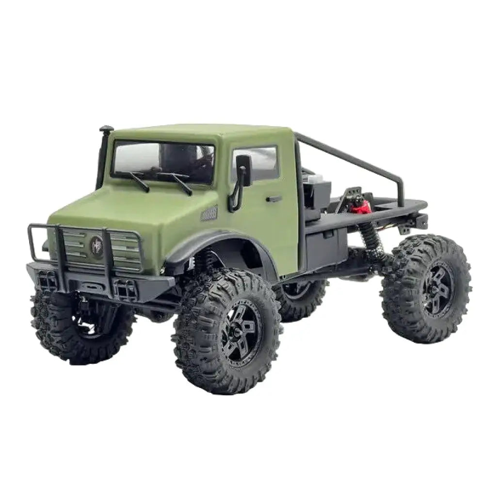 Green model truck with large wheels on a white background