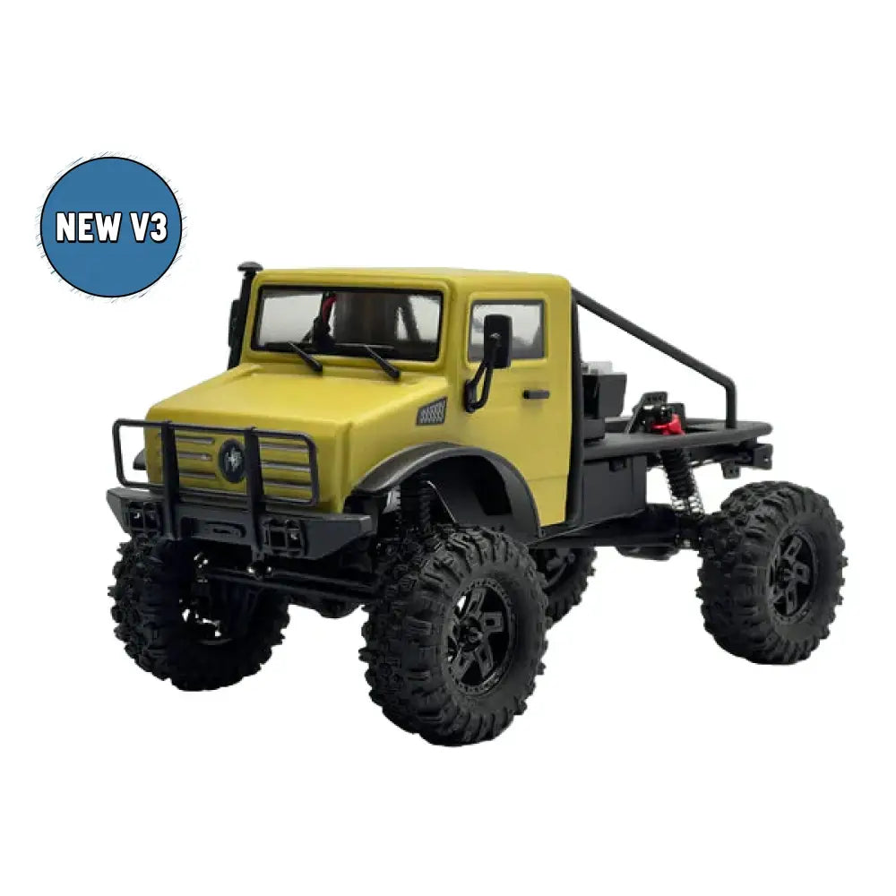 Model of a yellow off-road vehicle with large black tires on a white background