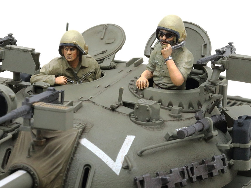 Tamiya 1/35 Tiran 5 Israeli Tank Plastic Model Kit with two figures inside, one on a radio, on a white background