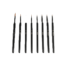 Set of black makeup brushes on a white background
